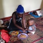 mother-feeding-child
